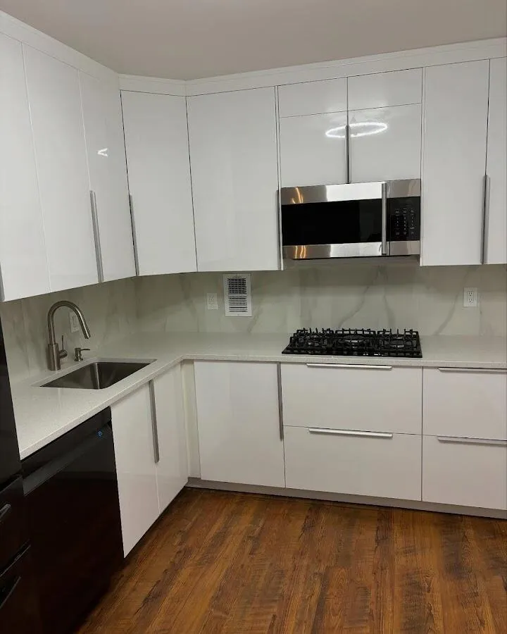 Restored kitchen with white cabinets after water damage in Sandy Oaks